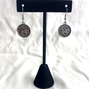 Silver tone TAURUS earrings.